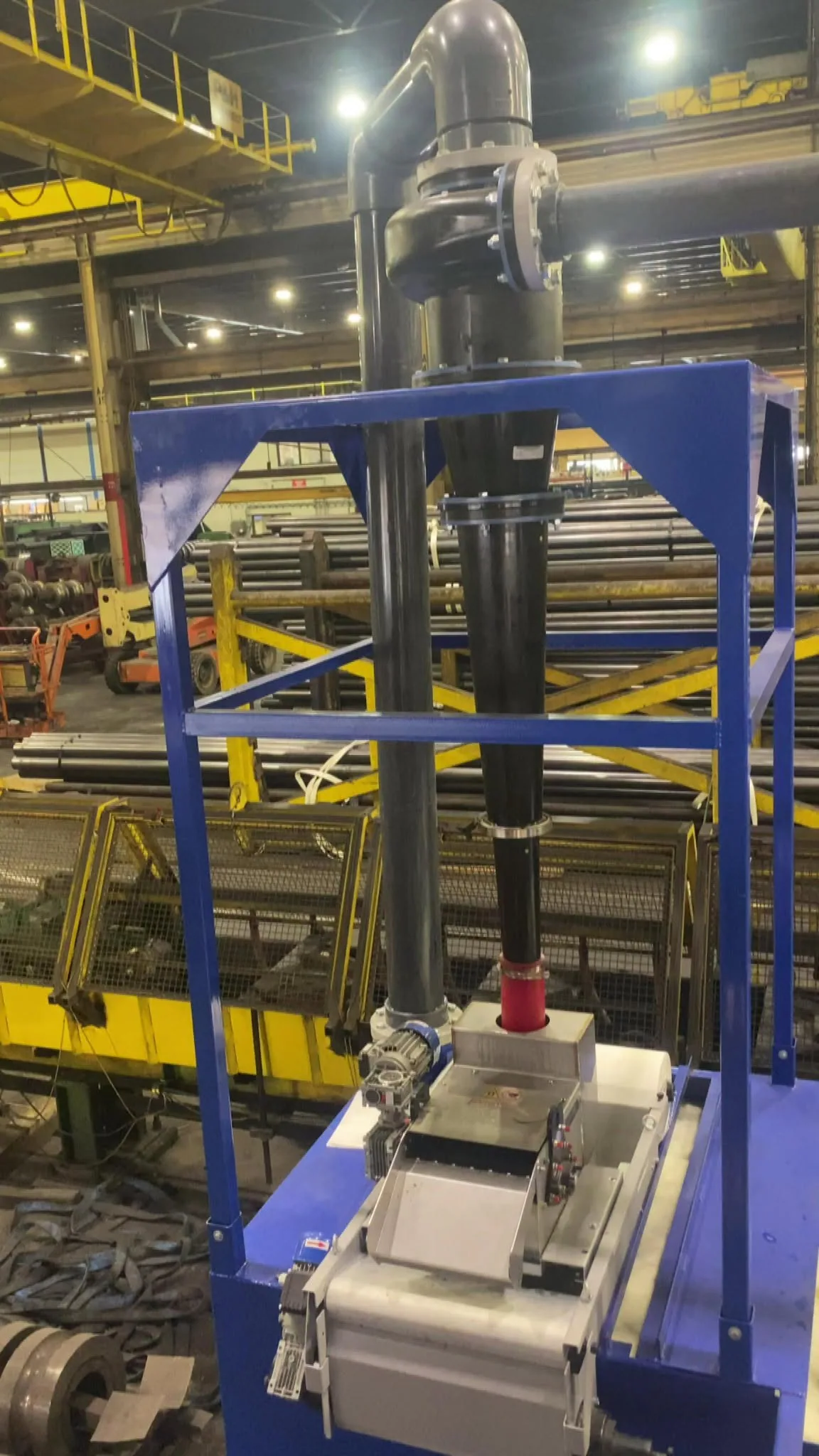 Another view of a TMCRS coolant recycling system beside a tube mill production line