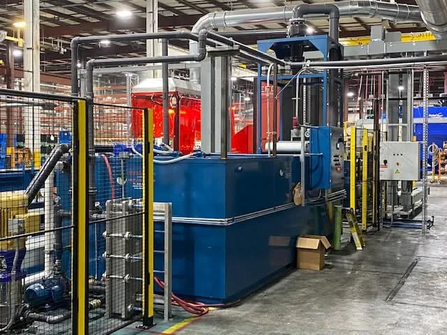 TMCRS coolant recycling system positioned beside production machinery