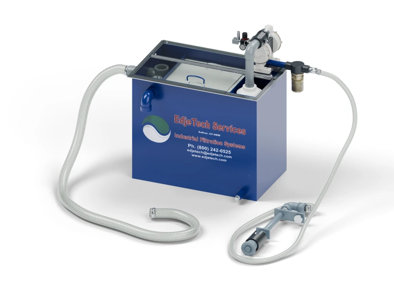 T.O.S.S. T1-AV tramp oil separator with clear cover, vertical skimmer, and connected hoses.